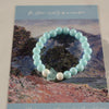 Aqua Blue Glass Beaded Bracelet: Pearl-Like Butterfly Charm