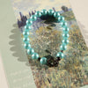 Aqua Blue Glass Beaded Bracelet: Pearl-Like Butterfly Charm