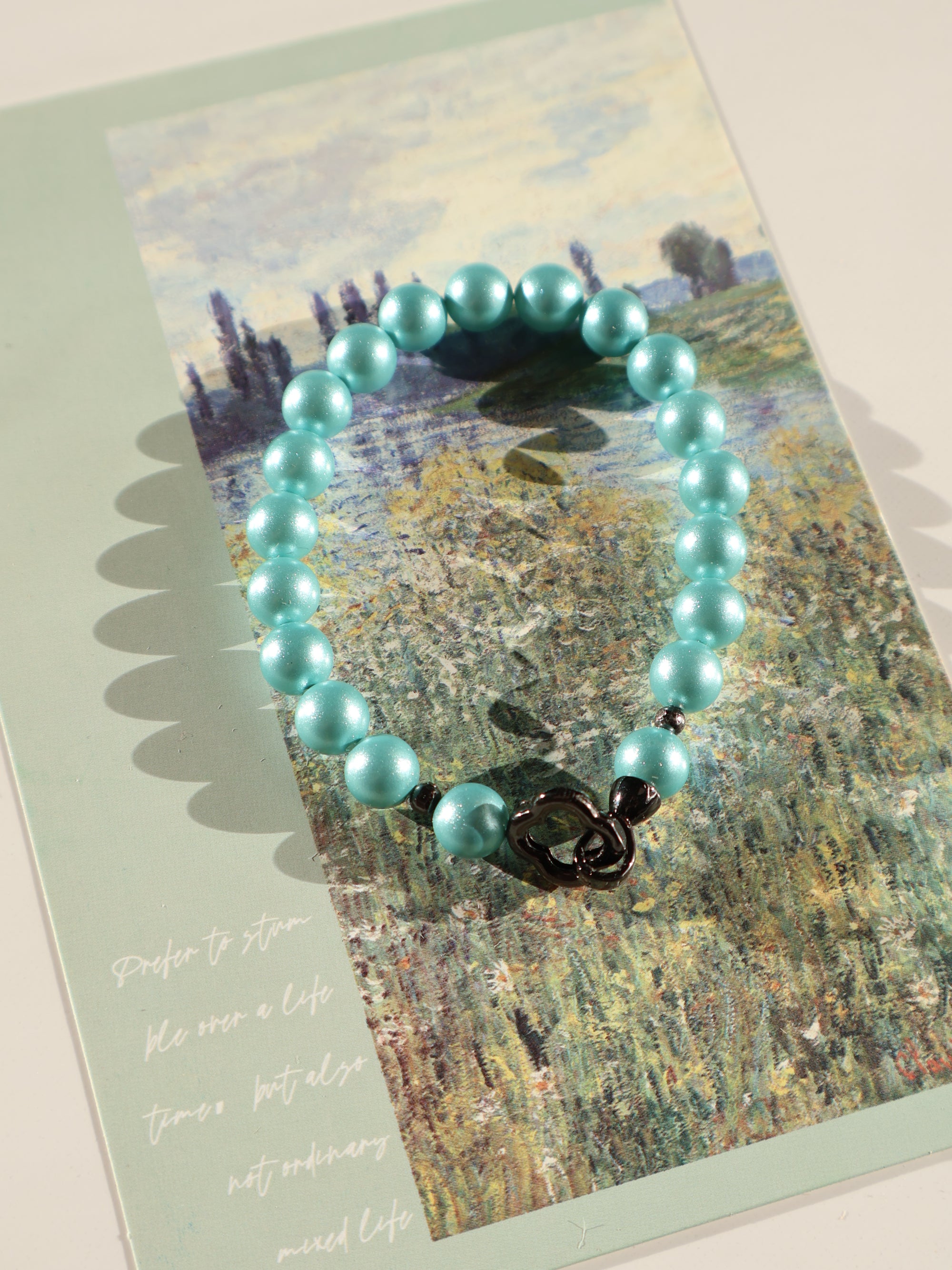 Aqua Blue Glass Beaded Bracelet: Pearl-Like Butterfly Charm