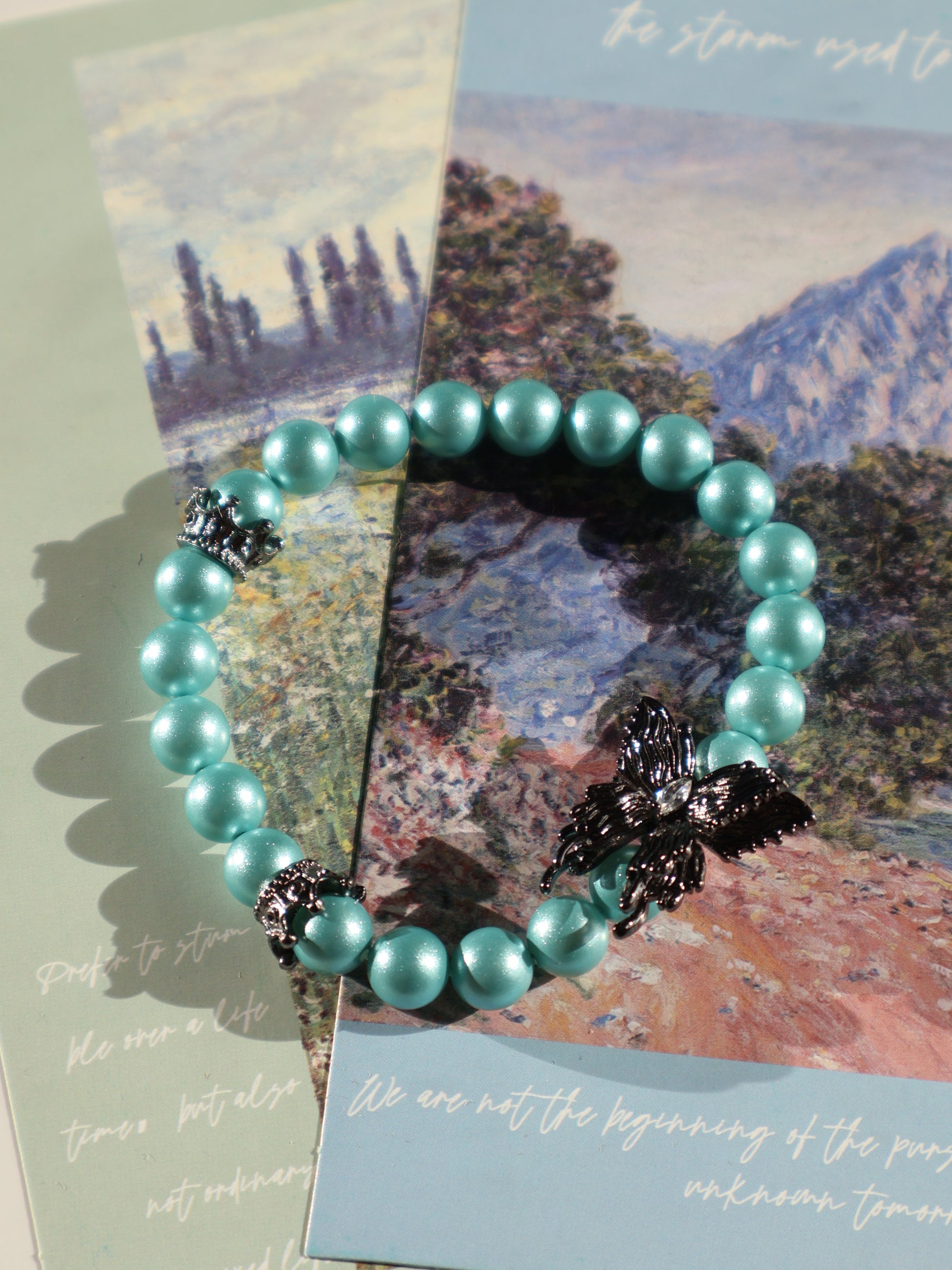 Aqua Blue Glass Beaded Bracelet: Pearl-Like Butterfly Charm